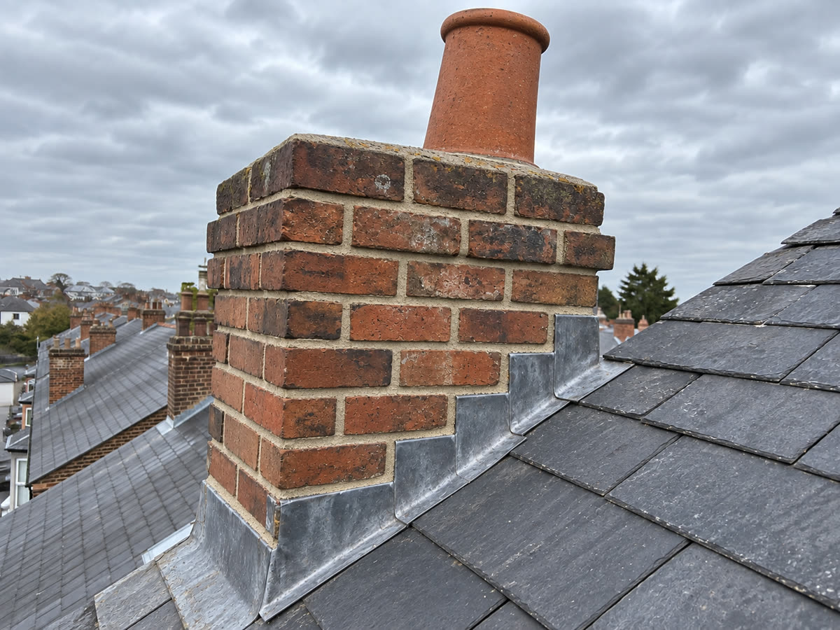 After: a repointed chimney with new lead flashing